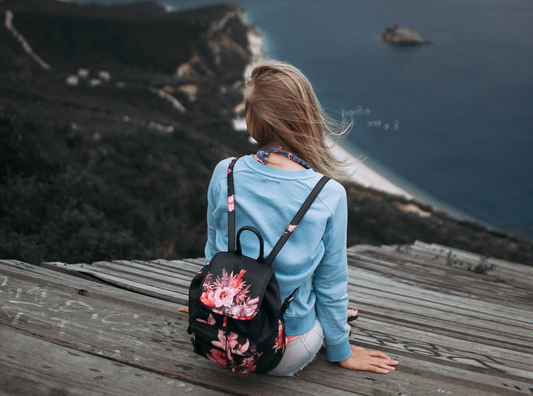 A girl seats near the beach