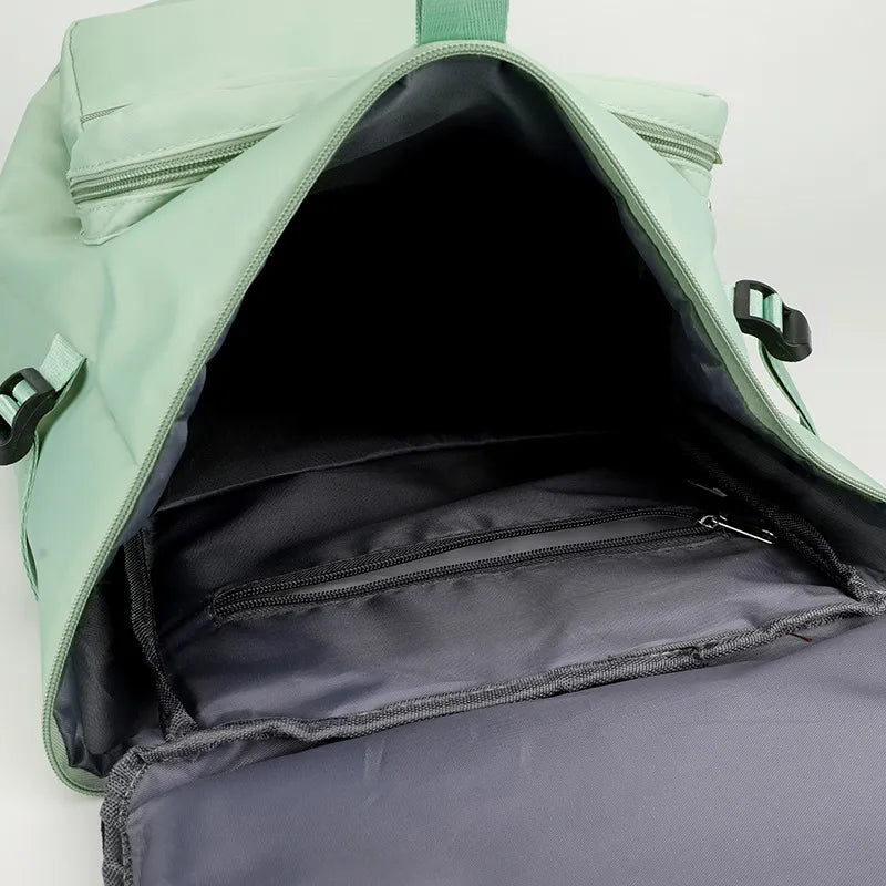 Green backpack with open top showing black interior