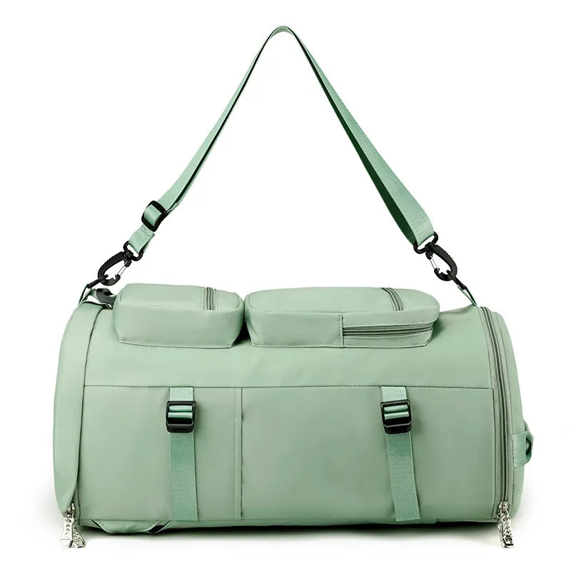 Mint green duffel bag with a strap on a white background