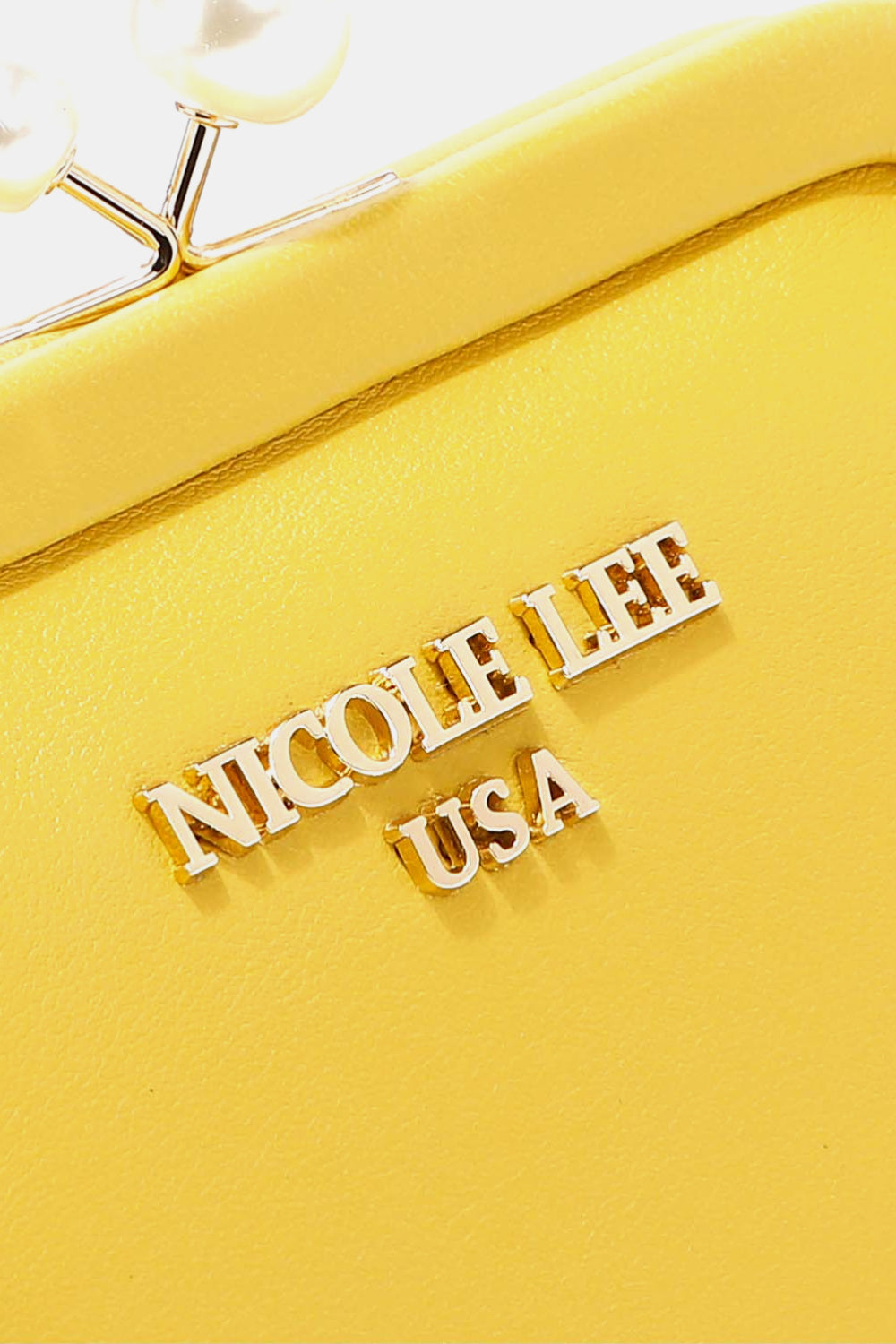 Yellow product with 'NICOLE LEE USA' branding on a white background