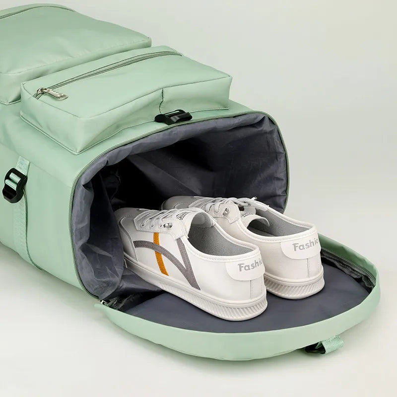 Light green backpack with white sneakers inside on a light gray background