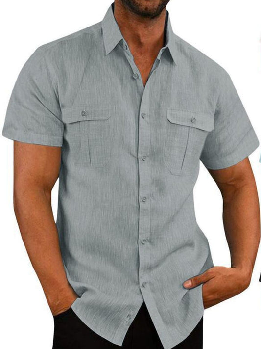 A man wearing a short sleeve collared neck shirt in gray color.