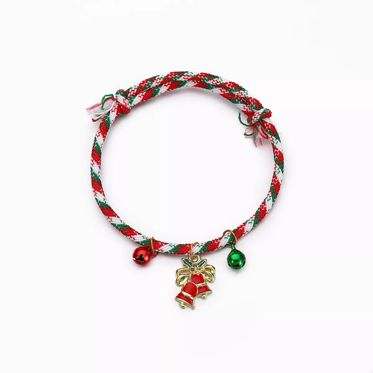 Red and green braided bracelet with festive charms on a white background