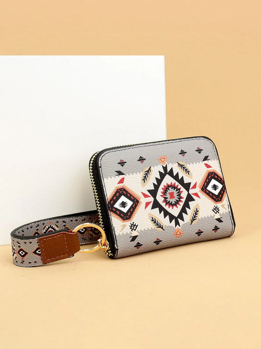 Patterned wallet with strap on a beige background