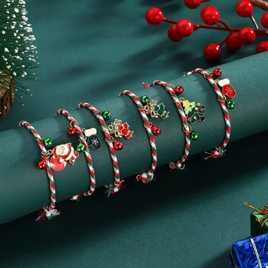 Set of Christmas-themed bracelets on a green surface with decorative elements.